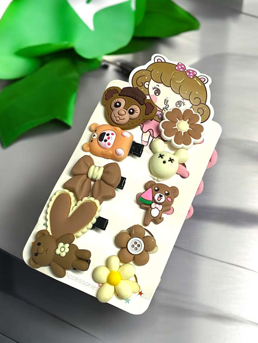 pack of multicolored rubber bands and hair clips