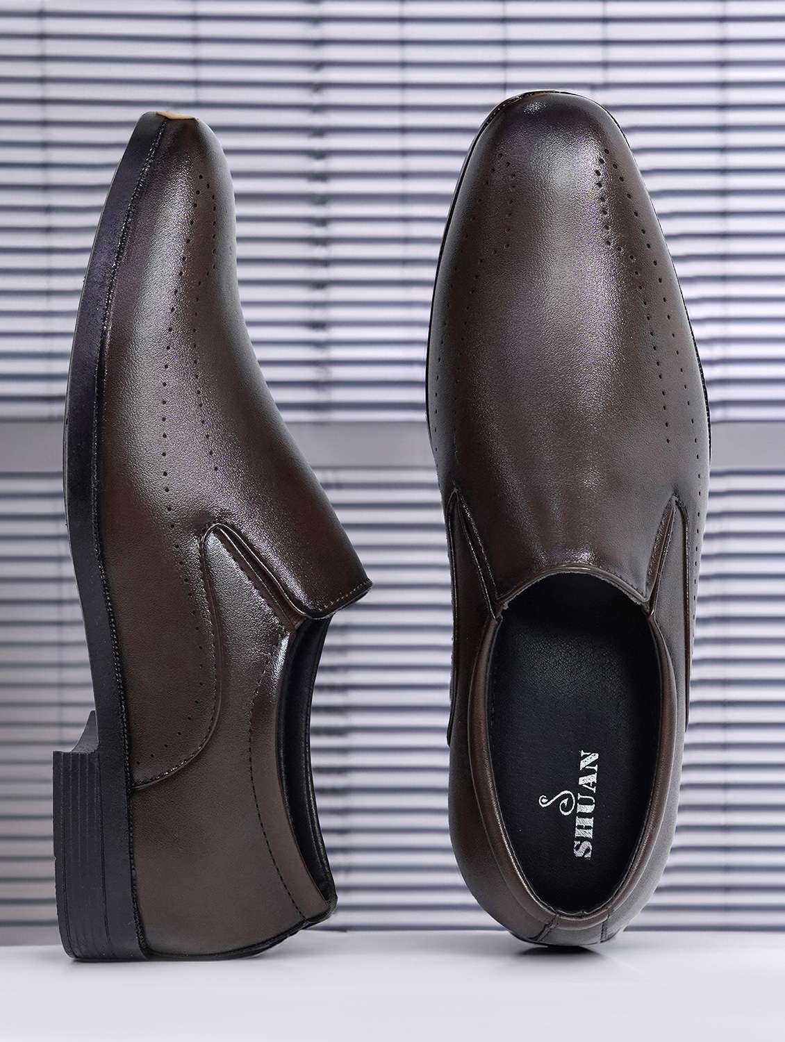 men brown slip on formal shoes