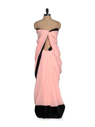 Classy peach georgette saree with velvet border