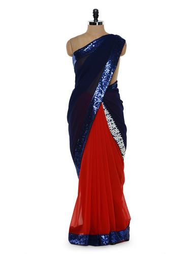 Sultry royal blue and red saree with sequined border