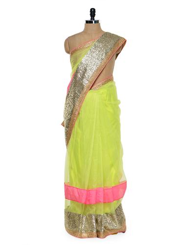 Vibrant lime green saree with sequined border