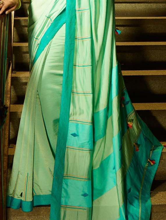Tassels Embellished Turquoise Saree With Blouse