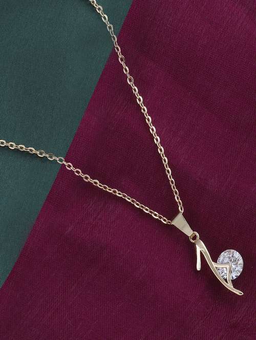gold metal pendant - 16586041 -  Standard Image - 0