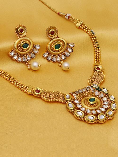 green gold plated necklaces and earring - 16697777 -  Standard Image - 0