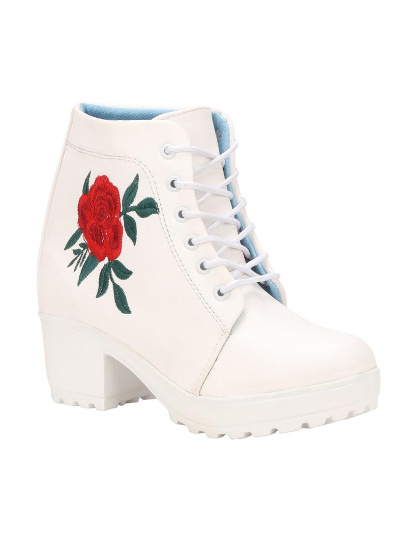 white synthetic ankle  boots