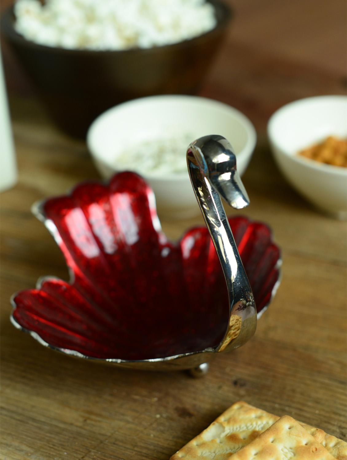 pair of red embossed brass swan bowls