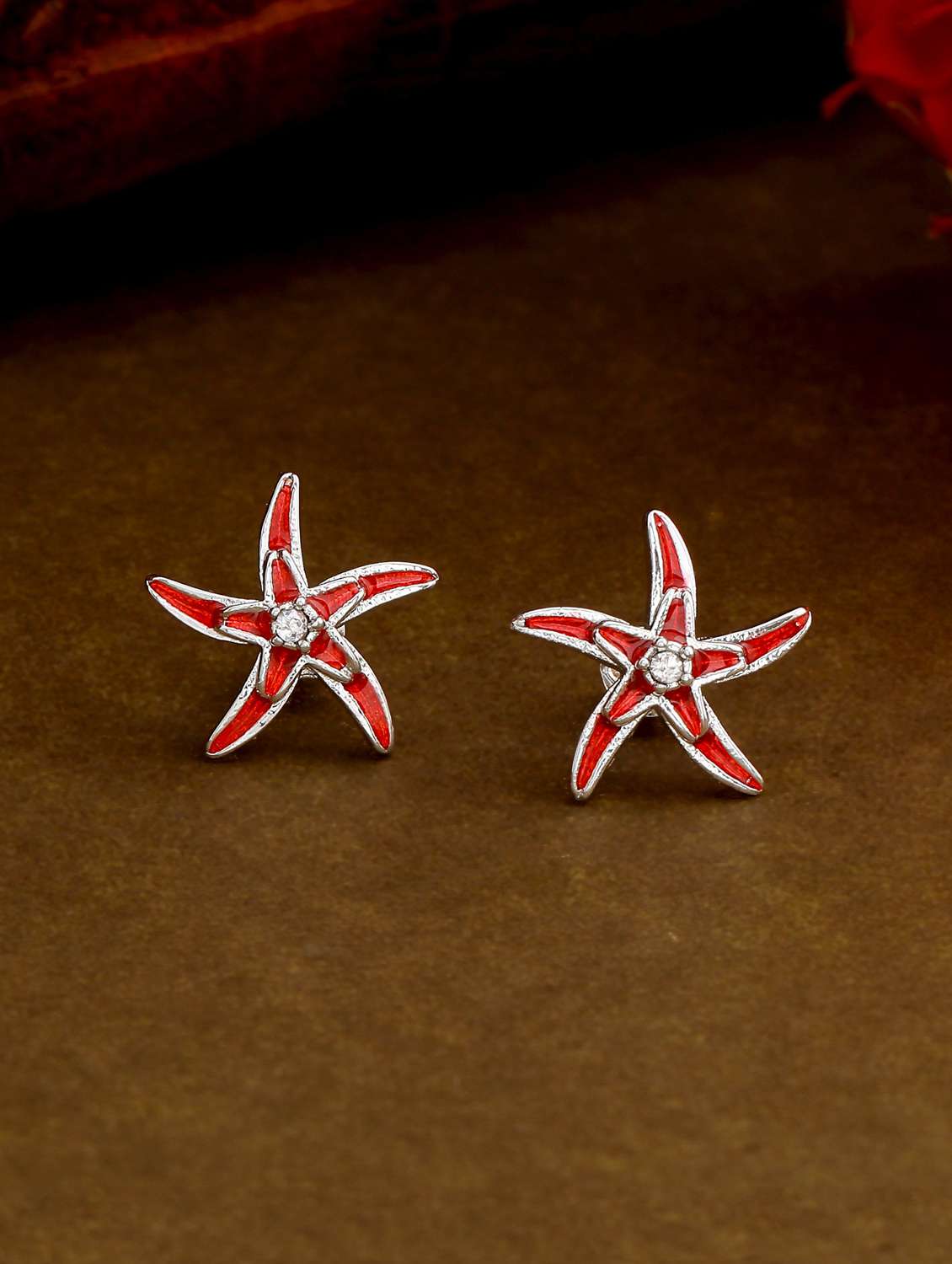 red  metal studs earring