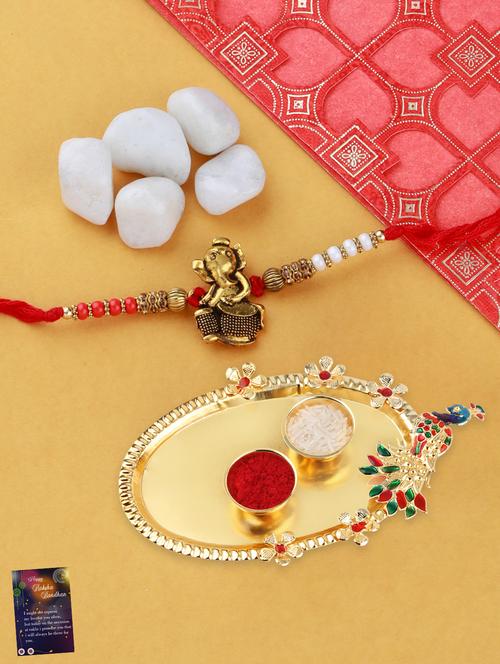 multi colored gold plated thread rakhi with roli chawal kankawati thali and greeting card  - 17900825 -  Standard Image - 0