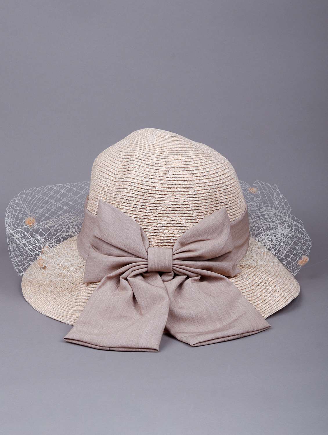 cream colored bow-tie boater hat