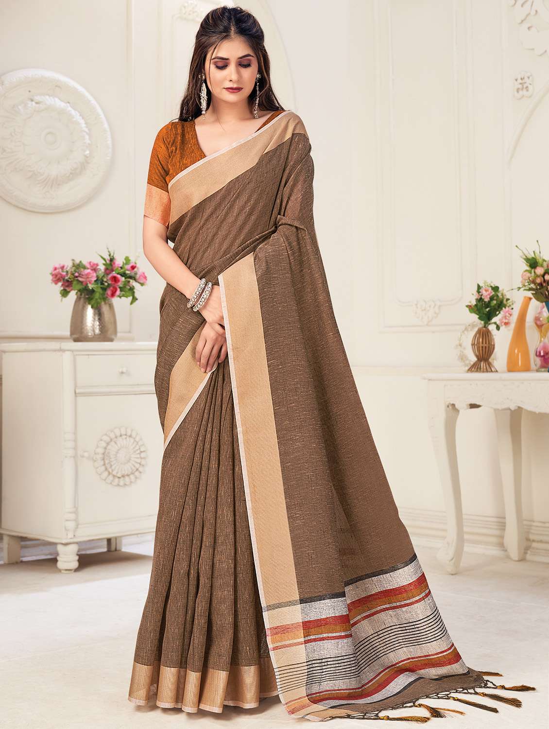 women's self design brown colored saree