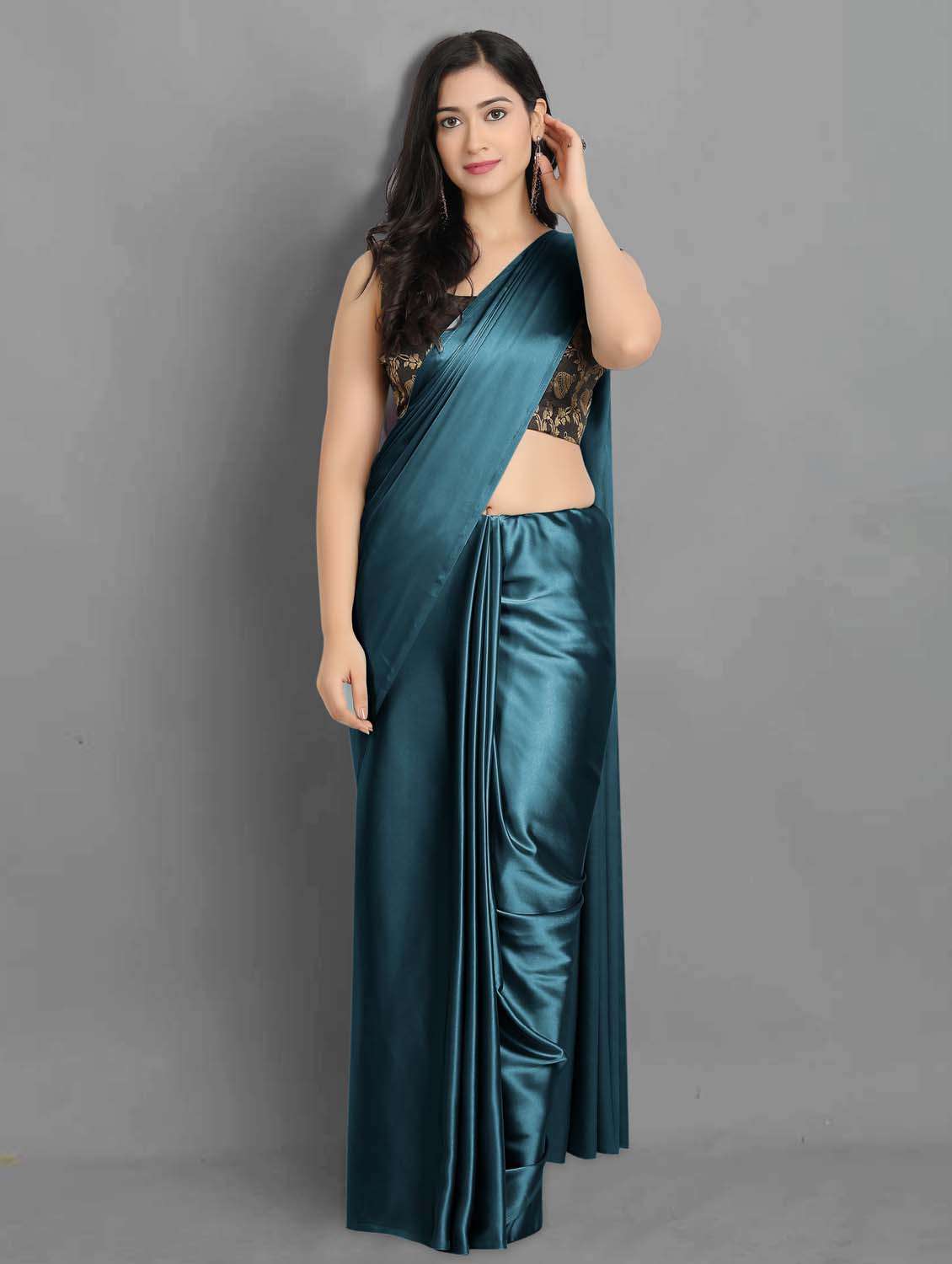 women's solid teal colored saree with blouse