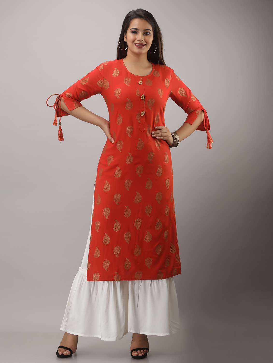 orange printed three quarter sleeve kurta sharara set