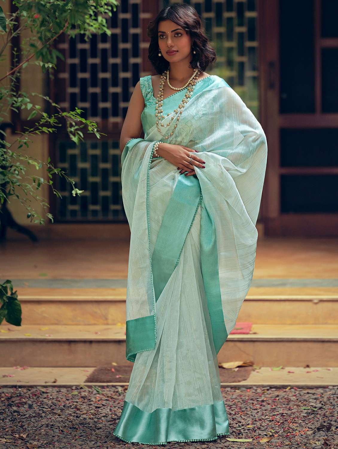 women's stripes turquoise colored saree with blouse