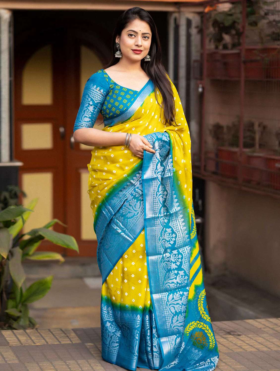women yellow bandhani printed saree with blouse