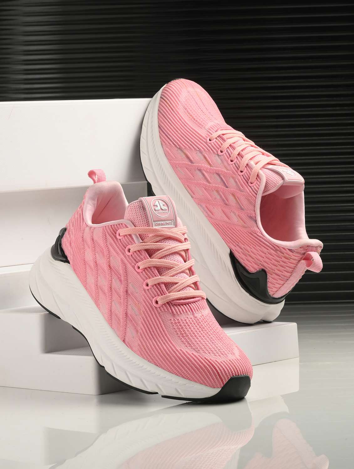 pink flyknit laceup sports shoes