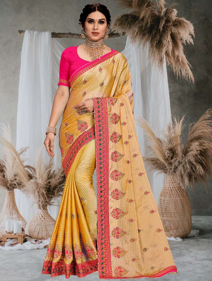 women yellow embroidered saree with blouse