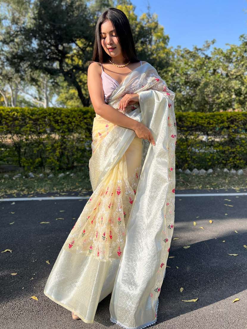 women yellow embroidered saree with blouse