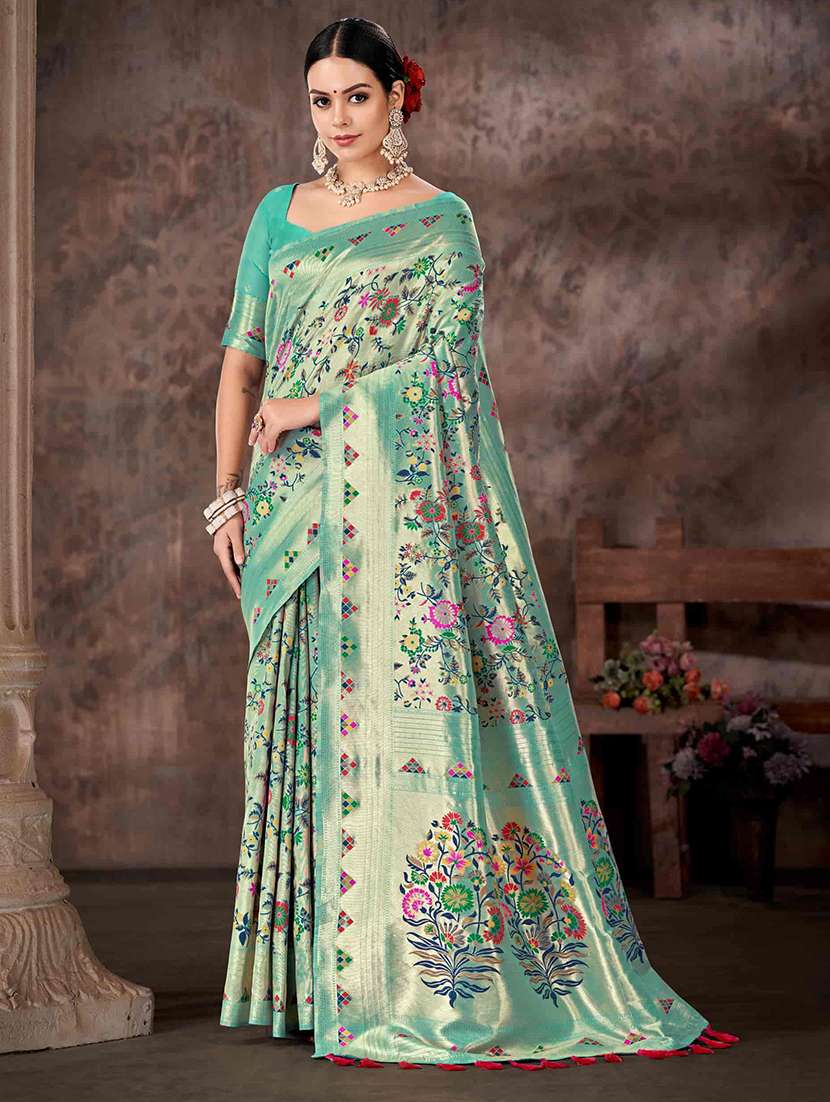 women turquoise baluchari saree