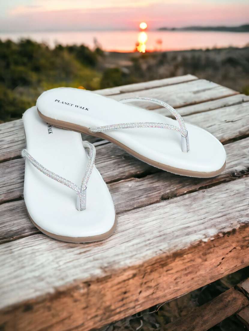 white synthetic slip on sandals
