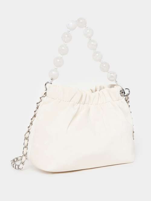 women cream solid handbag - 21505973 -  Standard Image - 0
