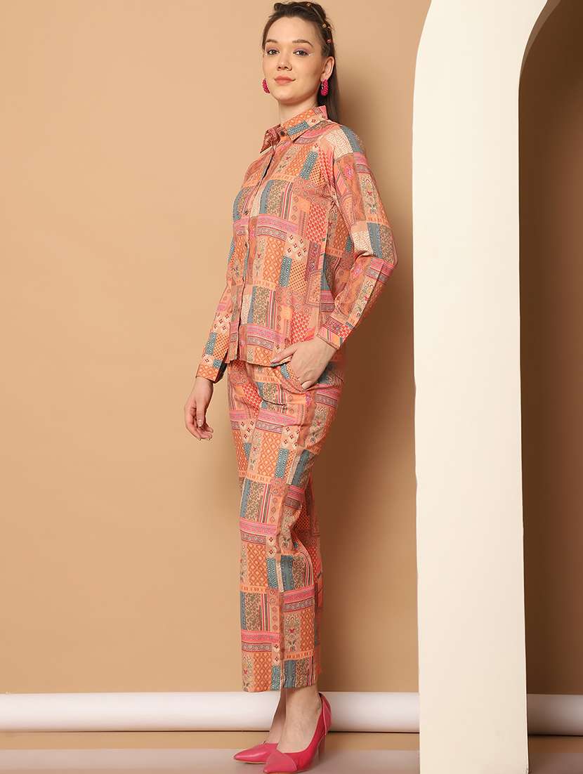 women orange printed shirt and trouser co-ord set