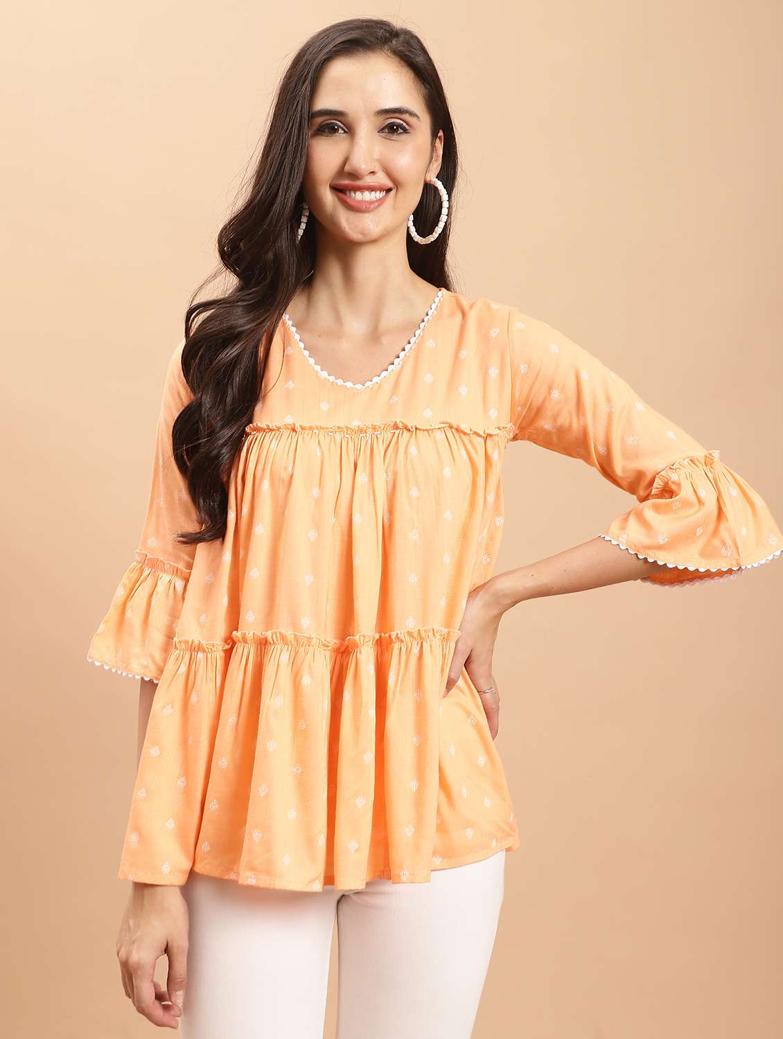 women orange printed bell sleeves tiered top