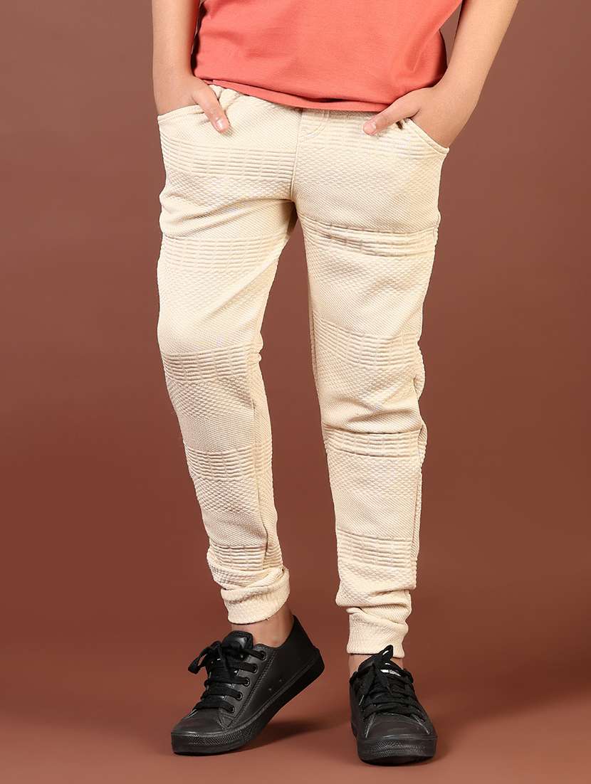 boys cream solid mid rise joggers