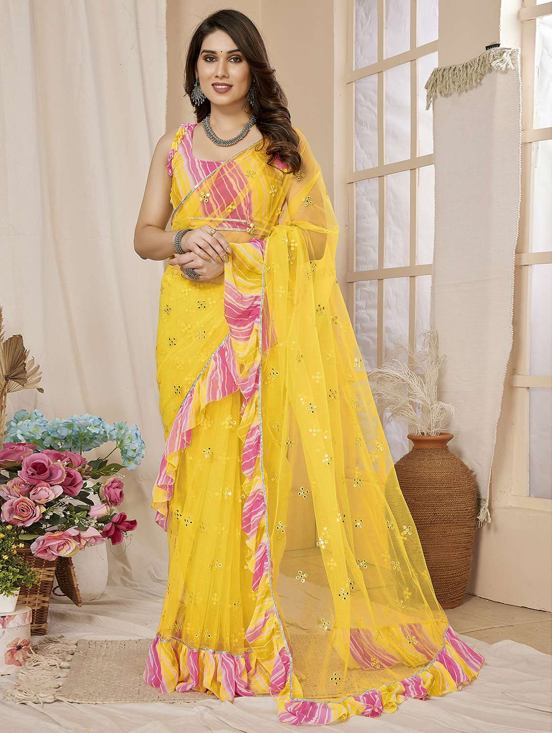 women yellow mirror work ruffle saree with blouse