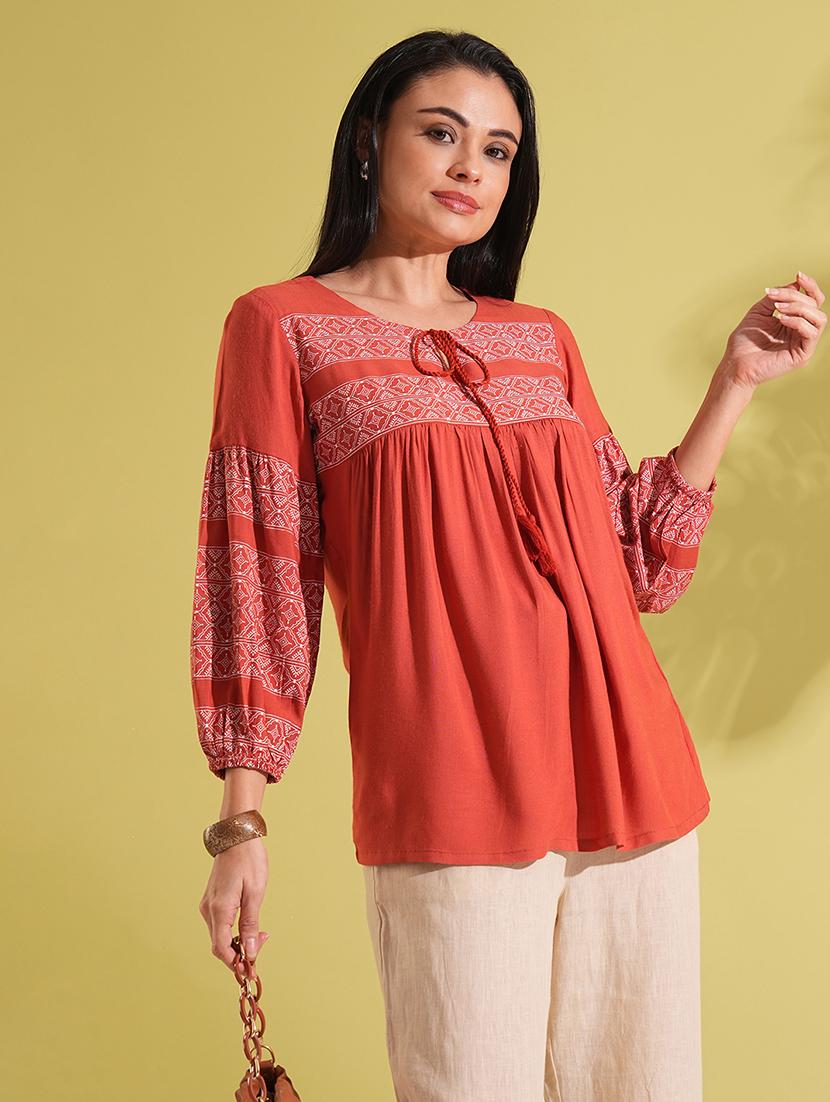 globus women rust tie-up round neck bishop sleeves ethnic print gathered a-line workwear tunic - 21704493 -  Zoom Image - 0