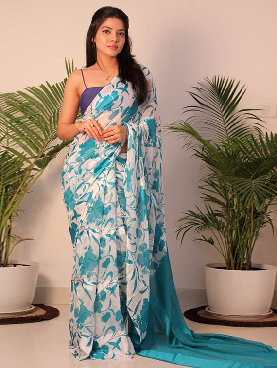 women turquoise floral printed saree with blouse