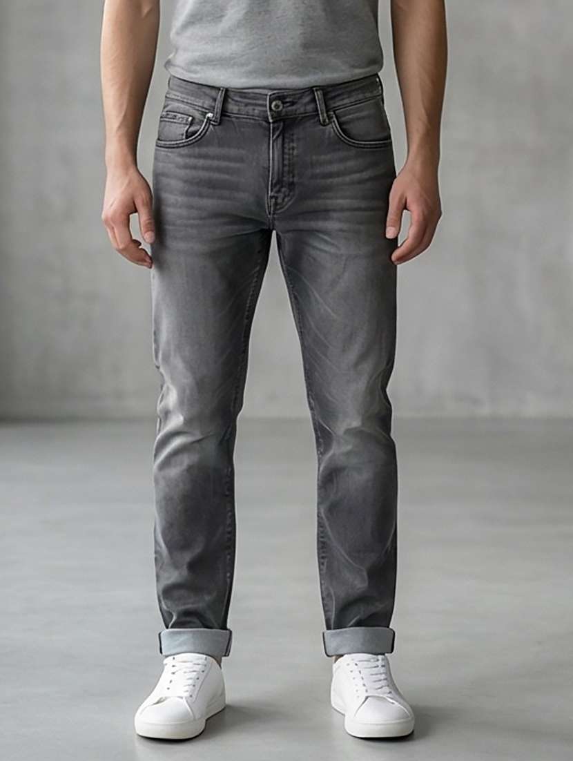 men washed high rise full length tapered jeans
