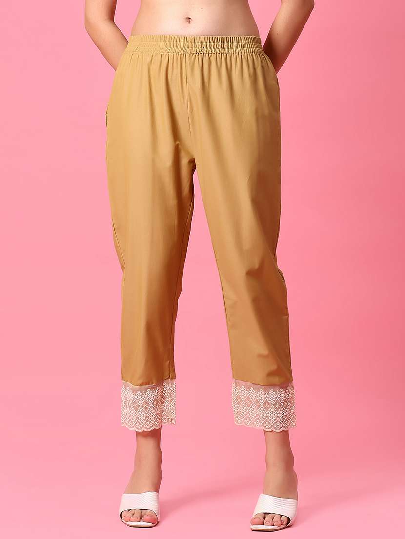 women beige solid mid rise tapered pant