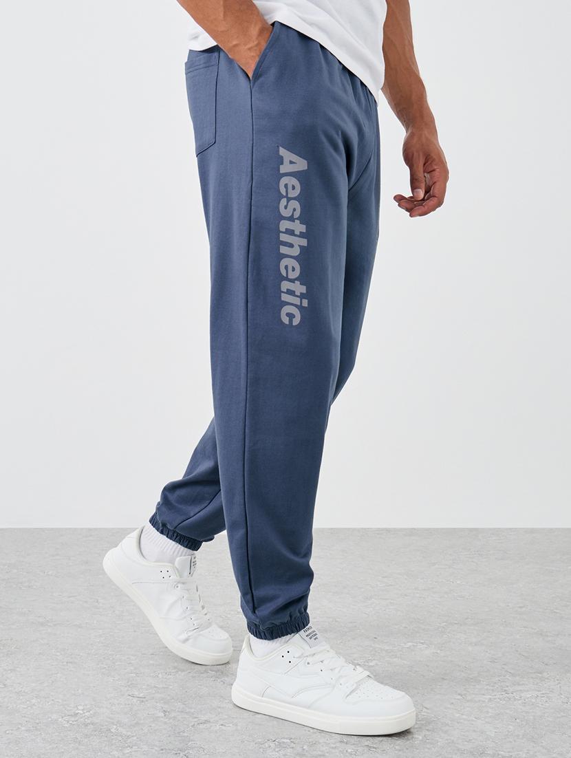 men typographic mid rise relaxed fit jogger - 21971582 -  Zoom Image - 0