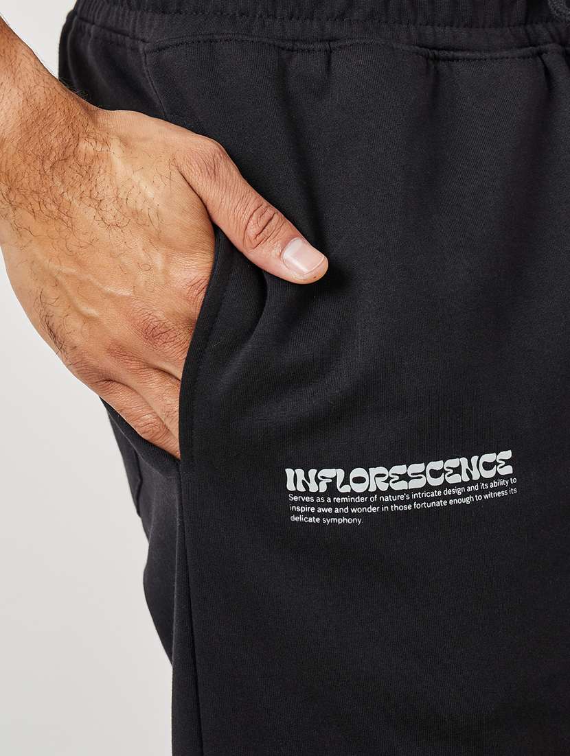 men placement print mid rise relaxed fit jogger - 21971694 -  Standard Image - 5