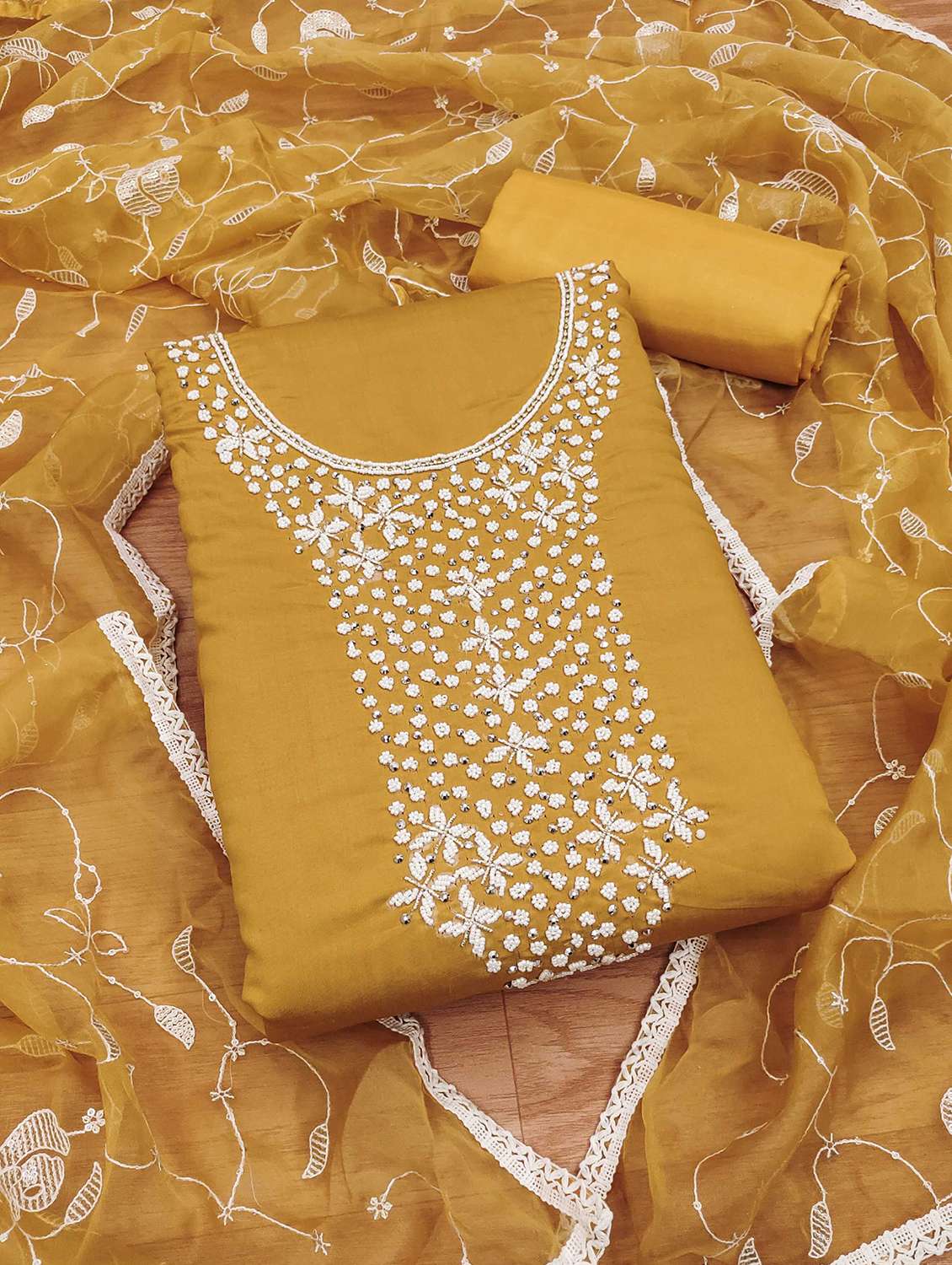 women embroidered unstitched suit set