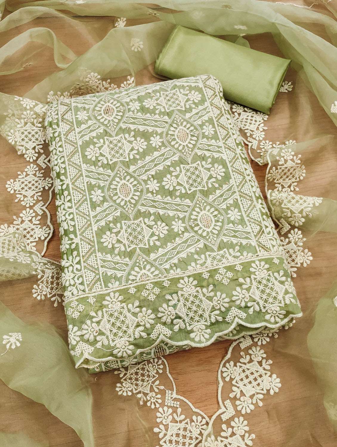 women solid with work embroidered unstitched suit set