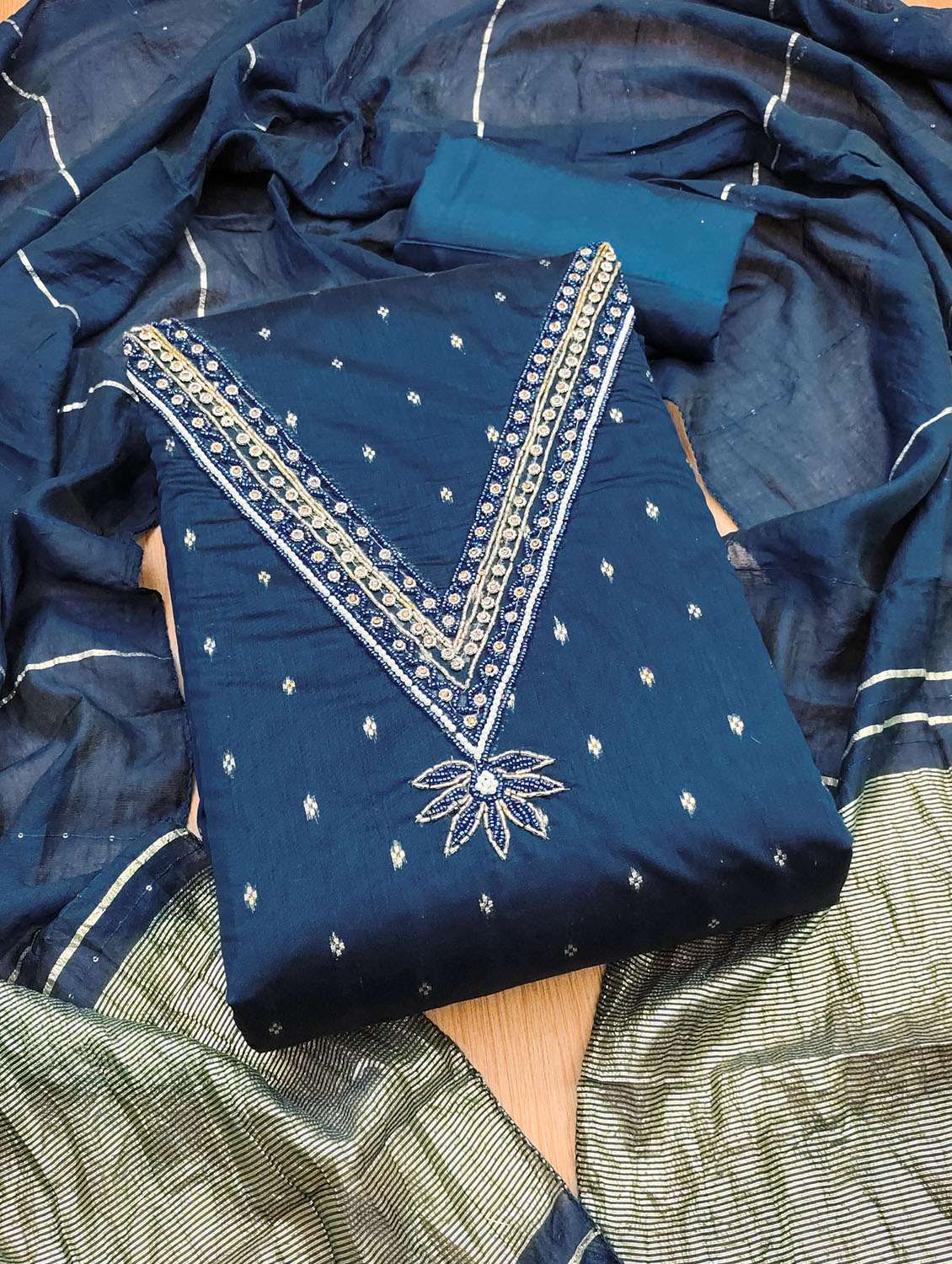 women self design embroidered unstitched suit set