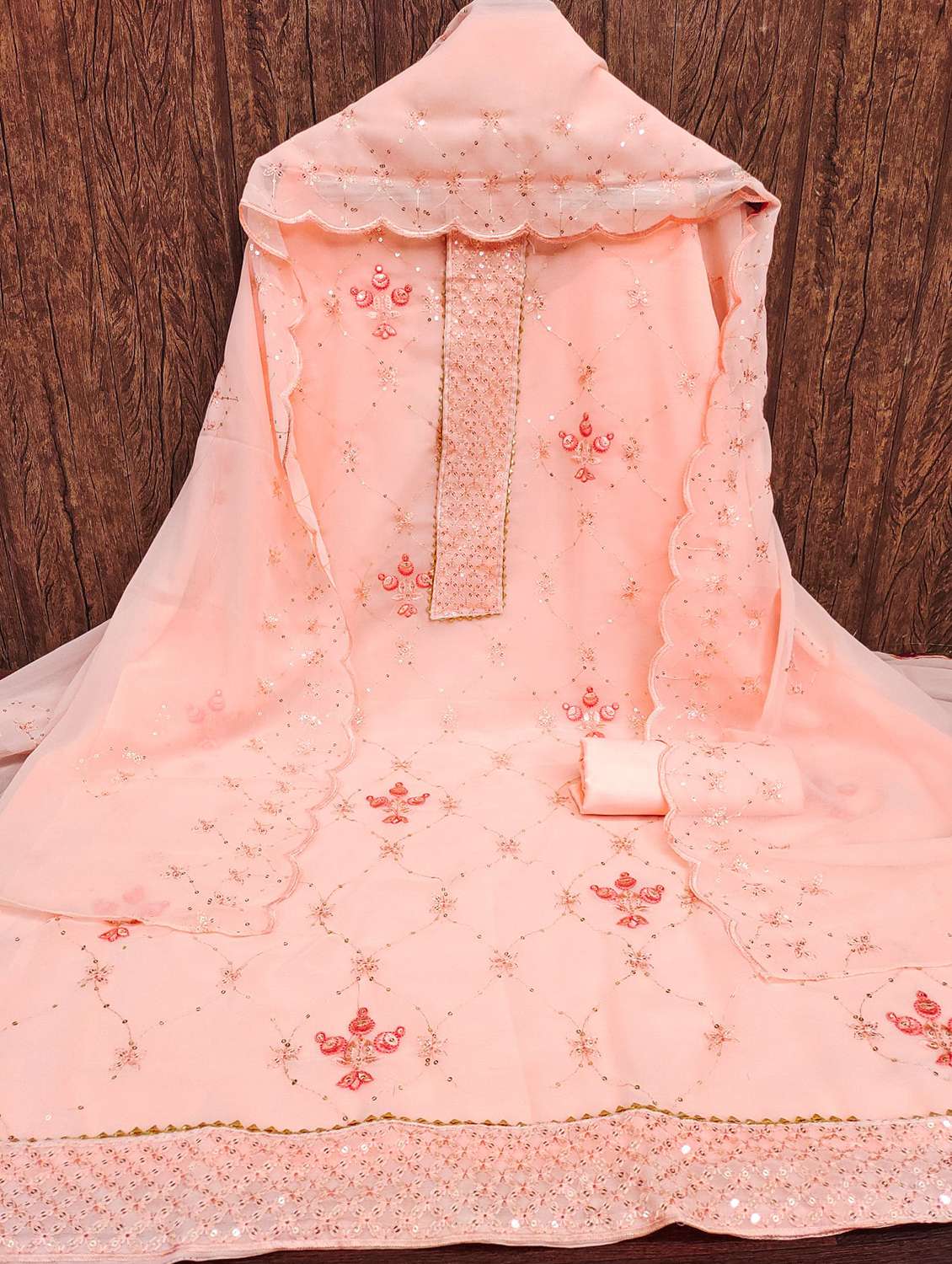 women solid with work embellished unstitched suit set