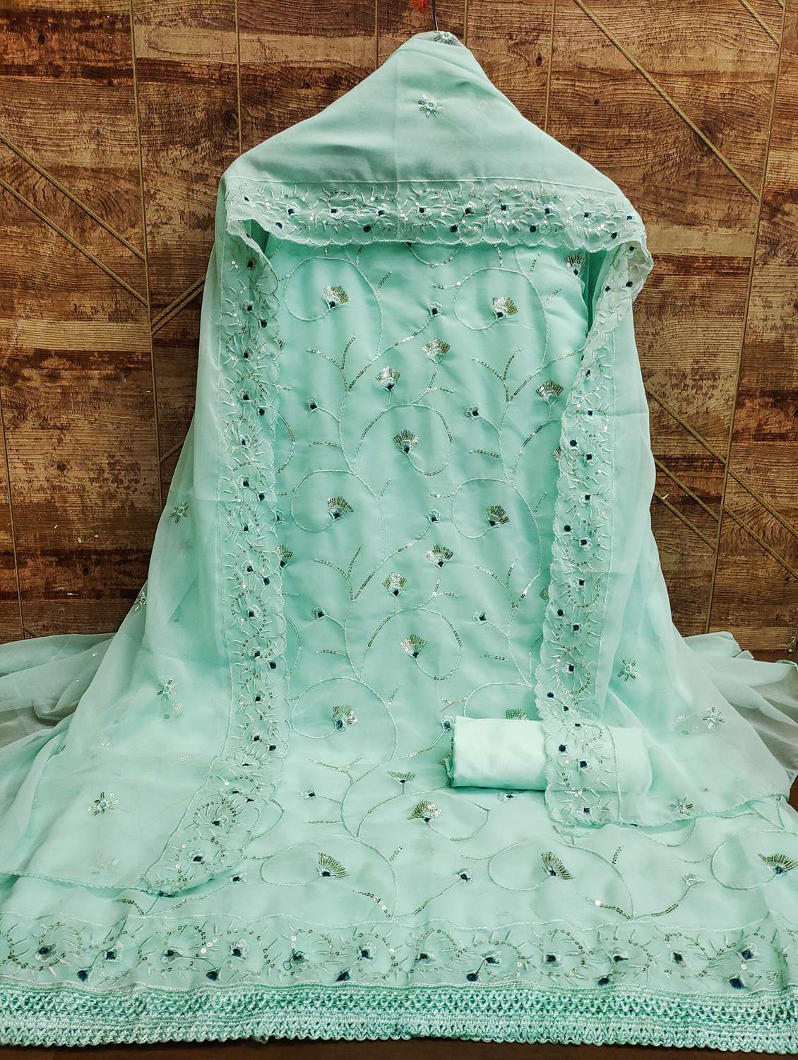 women solid with work embellished unstitched suit set