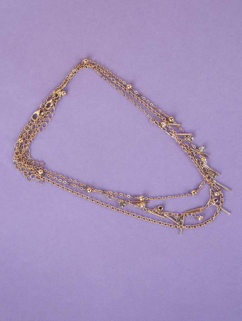 layered gold metal necklace with charms