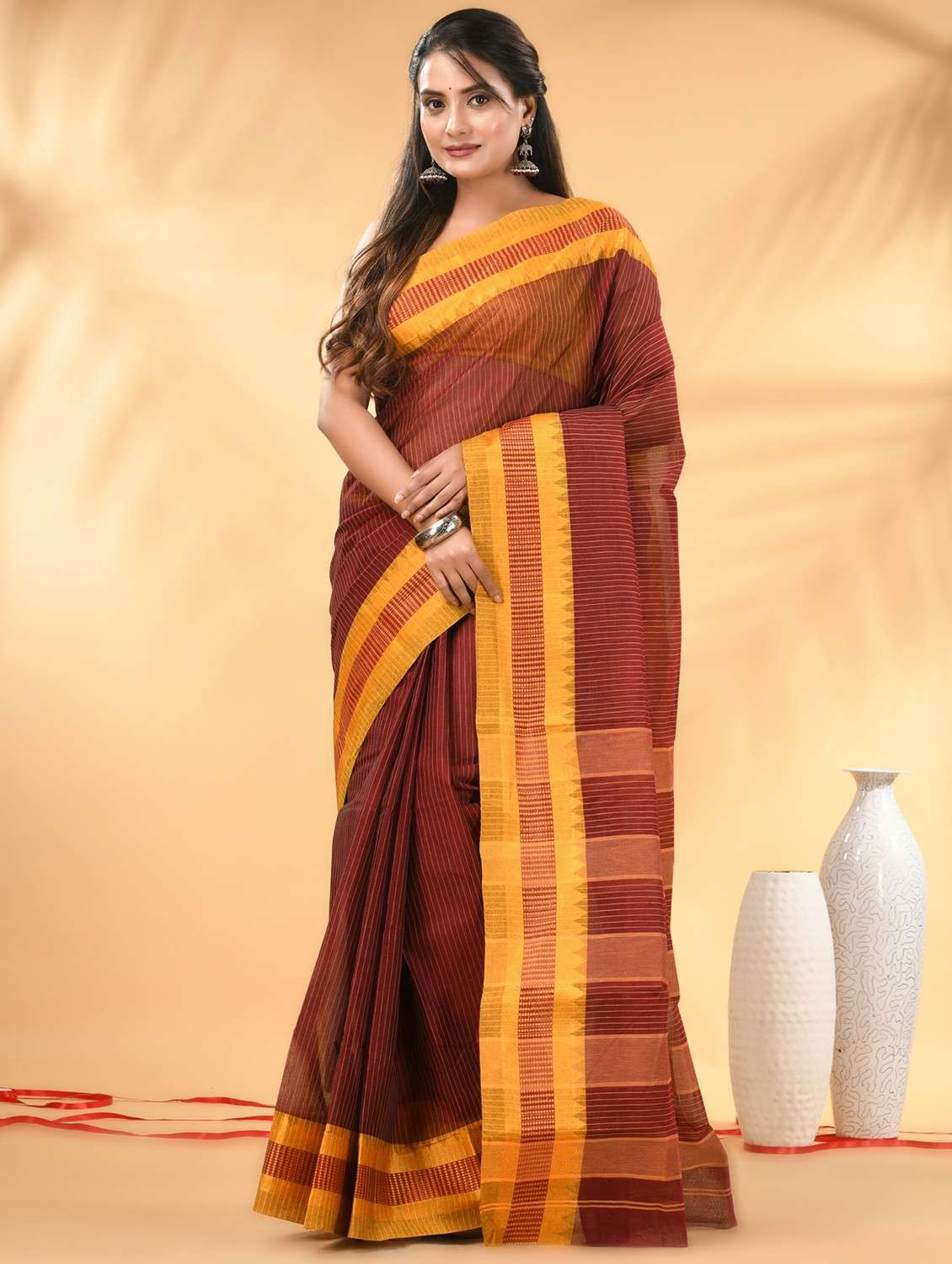 women striped tant saree