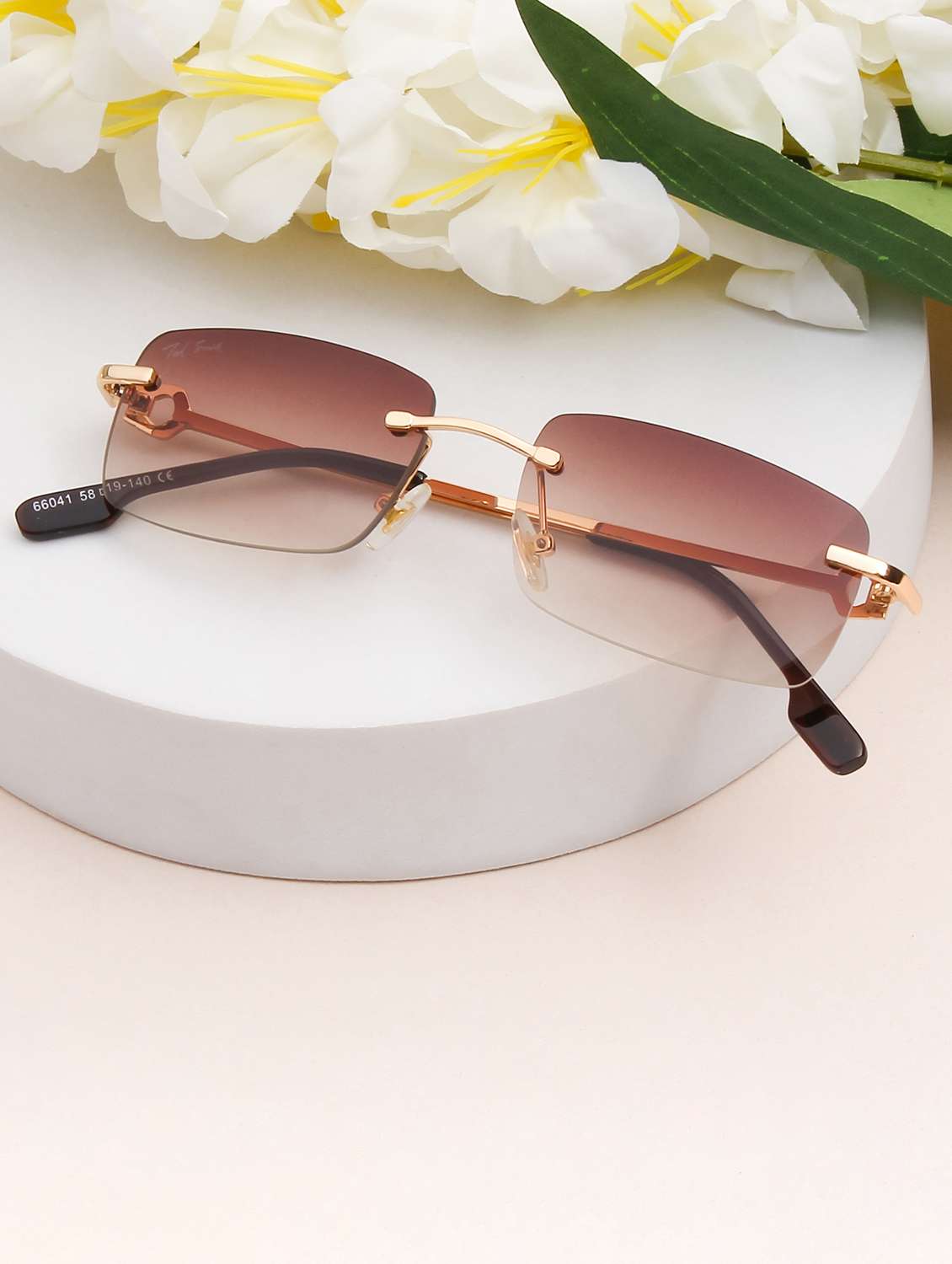 ted smith unisex aesthetic-bold gold-brown rimless sunglasses with uv protected lens