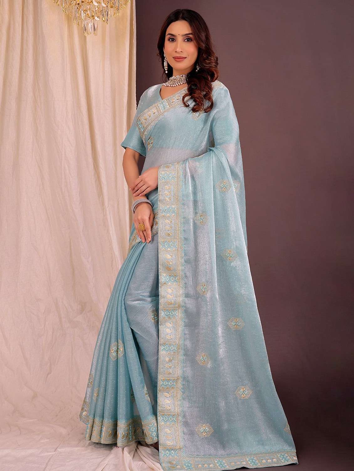 women solid with work embroidered saree with blouse