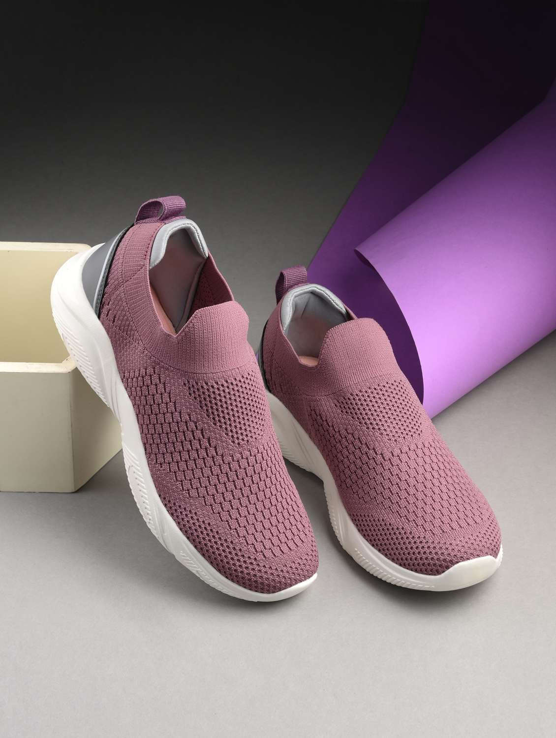 mauve flyknit slip on sports shoes