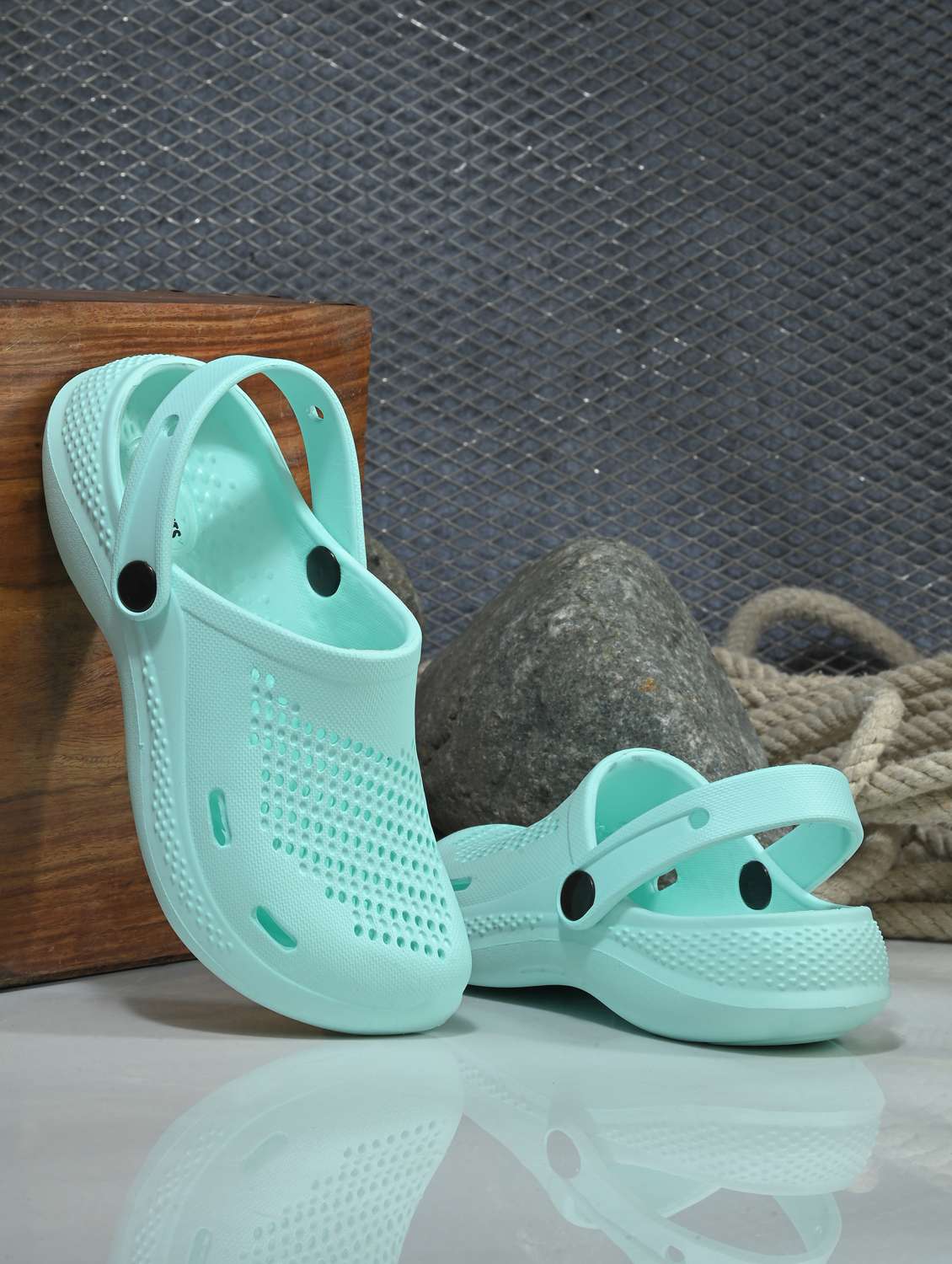 women green solid clogs