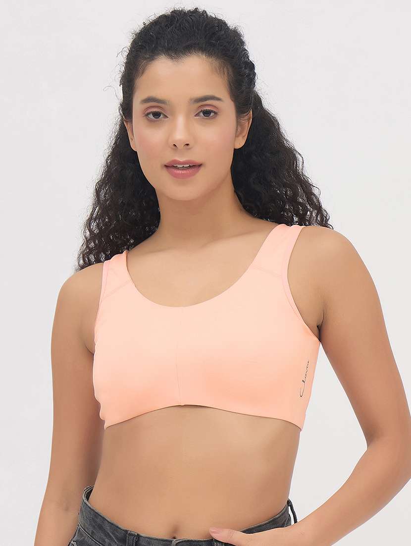 women peach solid non padded sports bra