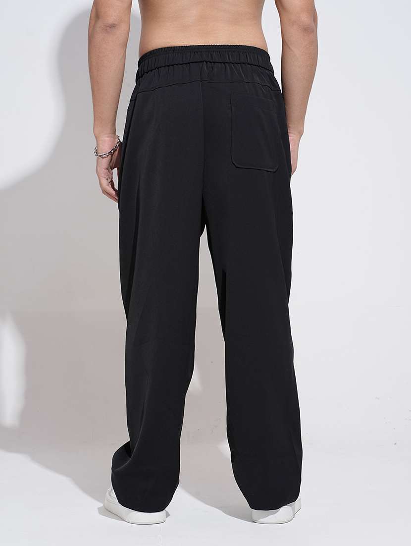 men black solid low rise loose fit parachute pant - 22038095 -  Standard Image - 3