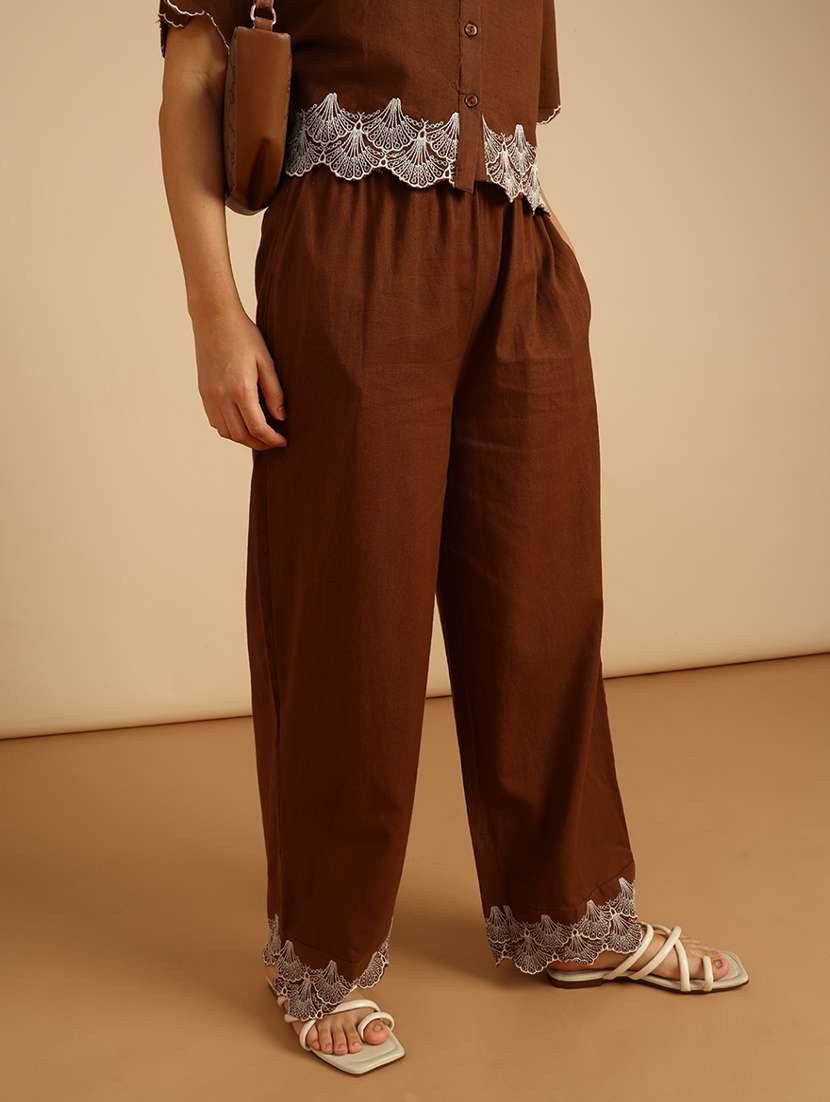 women solid mid rise embroidered hem palazzo