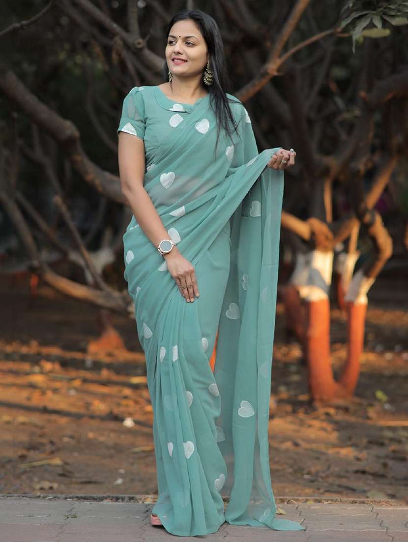 women solid with work embroidered saree with blouse
