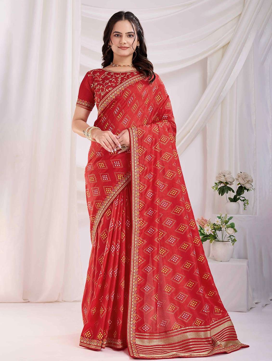 women bandhani printed bordered saree with blouse